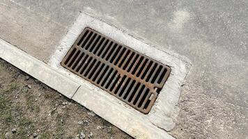 Drainage grate in asphalt. photo
