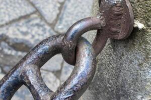 Close-up of an Old Rusty Chain Isolated on a White Background. photo