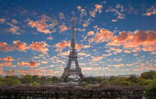 Eiffel Tower at Sunset in Paris, France. Romantic Travel Background. Amazing Panorama of Paris with Eiffel Tower Included photo