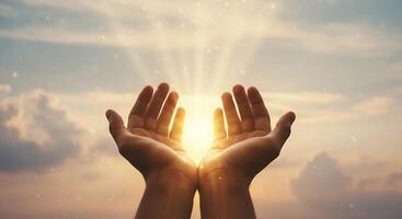 Human palms reach out to the rays of the sun photo