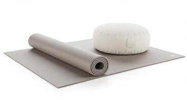 A yoga mat paired with a comfortable pillow, ready for a peaceful and restorative practice session. photo