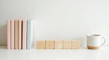 Minimalist Desk Setup with Pastel Folders, Wooden Calendar, and Ceramic Cup photo