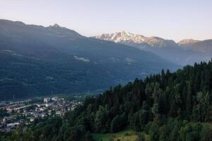 Panoramic view from above of the Tarentaise massif and valley at sunrise in summer photo