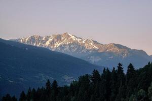 High view of the Tarentaise massif at sunrise in summer photo