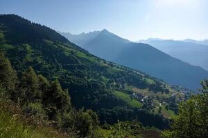 View of the mountain pastures and the Tarentaise massif in Savoie photo