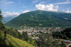 Aerial view of Bourg-Saint-Maurice from the low heights of the mountain pastures photo