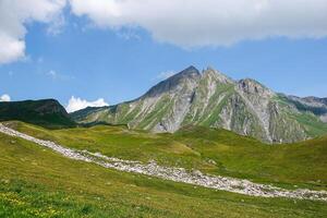 View of a plateau and mountain range high in the Alps at Bourg-Saint-Maurice photo