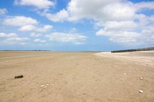 Sandy beach at low tide in the Bay of Somme in Le Crotoy photo