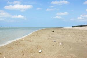 Sandy beach at rising tide in the Bay of Somme at Le Crotoy photo