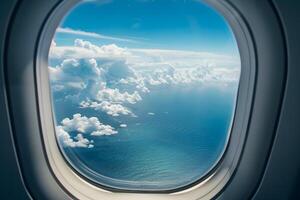 Airplane window view over ocean and clouds, summer photo