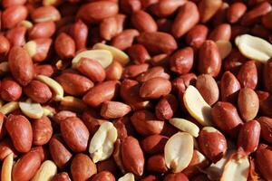 Mixed peanuts background, top view, food background. photo