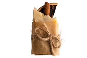 Homemade cinnamon soap is packed in paper and tied with a rope png