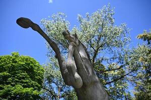 a statue of a horse with its head up in the air photo