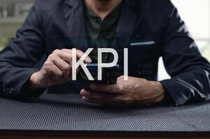 Business Professional Analyzing KPI Data on Smartphone Application photo