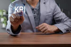 Business Professional Demonstrating Key Performance Indicator Concept photo