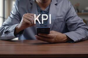 Business Professional Analyzing Key Performance Indicators on Phone photo
