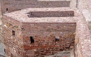 Ancient Fortress Walls Detailed Texture of Historic Brickwork and Stone Masonry photo