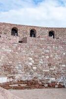 Ancient Stone Wall Architecture Historical Masonry, Fortification Texture, Medieval Building Design photo
