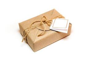 The Gift box wrapped in the kraft paper and rustic hemp as natural rustic style photo