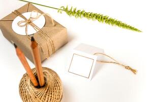 Gift box wrap in kraft paper and rustic hemp as natural rustic style photo