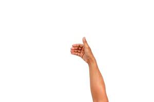 Isolated arm and hand gesture, holding or presenting a small object on a white background photo