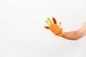 Colorful glove on hand symbolizing diversity and inclusion with a bright background ready for creative concepts photo