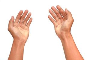 Two open hands reaching upward on a plain white background, ready for action or supplication photo