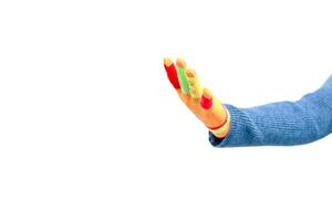Close-up of a colorful hand puppet arm reaching out, isolated on white background to create a feeling of fun and creativity photo