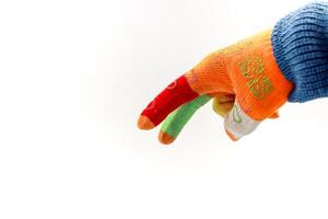 A Colorful Knitted Glove Against a White Background, Ideal for DIY and Craft Projects photo