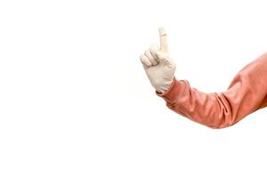 Gloved Hand with Index Finger Raised, Emphasizing Hygiene and Precautions during the Pandemic and beyond photo