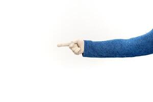 Gloved Hand with Blue Sweater Pointing Left Isolated on White Background, concept for direction or guidance photo
