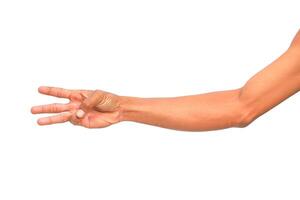 An arm extends with the hand showing a gesture signifying number three in plain view photo