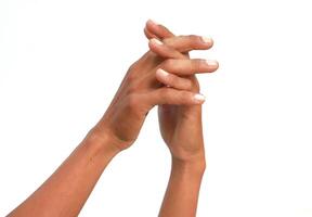 Intertwined Hands Expressing Unity and Connection on a Clean White Background photo