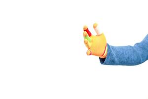 Isolated image featuring a hand wearing a colorful knitted glove against a plain white background showcasing vibrant finger tips photo