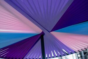 Underside View of Colorful Geometric Umbrella with Pleated Texture photo
