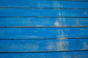 Weathered Blue Wooden Planks with Visible Grain and Texture photo
