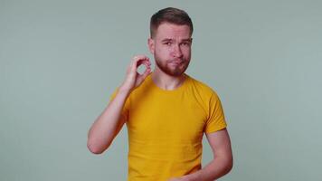 Frightened scared man closing his mouth gestures no, refusing to tell terrible secret, truth video