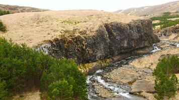 Aerial view of the scenery in Iceland with a waterfall video