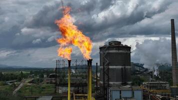 Burning a torch at a chemical plant. Emission of harmful substances into the atmosphere Chimney With Fire in chemical industry company video