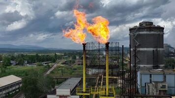 Burning a torch at a chemical plant. Emission of harmful substances into the atmosphere Chimney With Fire in chemical industry company video