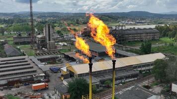 Burning a torch at a chemical plant. Emission of harmful substances into the atmosphere Chimney With Fire in chemical industry company video