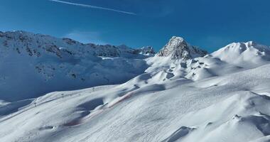 Winter drone shot of ski pistes and slopes covered with fresh powder snow in Tignes in Valdisere France video