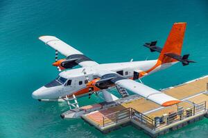 Seaplane on a turquoise dock photo