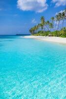 Vertical panoramic tropical beach with white sand and turquoise sea, exotic island paradise for summer vacation, peaceful travel background with ocean view and clear horizon photo