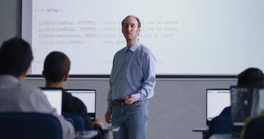 Professional Programmer Man Teaching Young School Students, Portrait Of Man In Classroom video