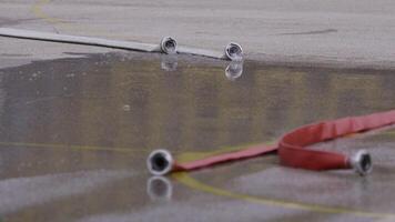 An up-close shot captures a fire hose with a powerful stream of water, highlighting the precision and force of this firefighting tool in action video