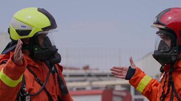 A team of firefighters comes together to celebrate and share their joy and relief after a successful operation, demonstrating the strong bond and camaraderie among these heroic individuals video