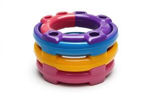 A stack of colorful plastic rings on a white background photo