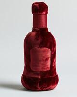 A red velvet bottle with a red cap photo