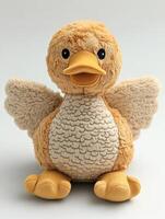 A stuffed duck with wings on a white background photo